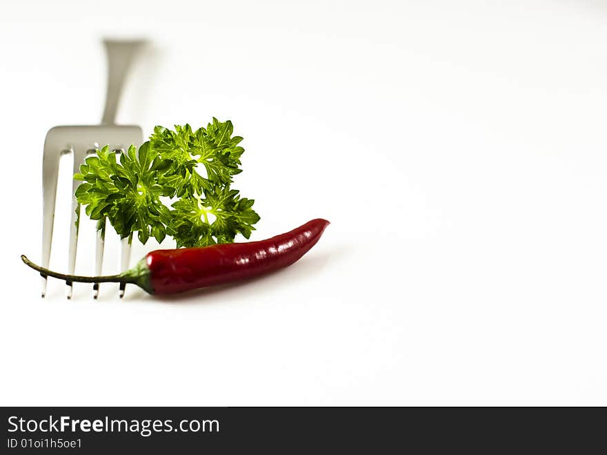 Fork with pepper and parsley