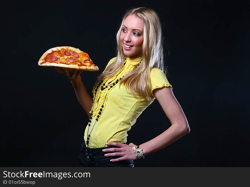 Beautiful young woman eating pizza