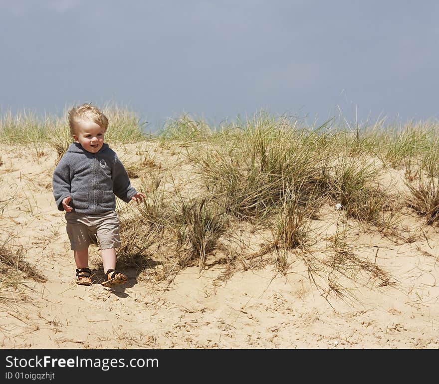 Little boy on sand dunes