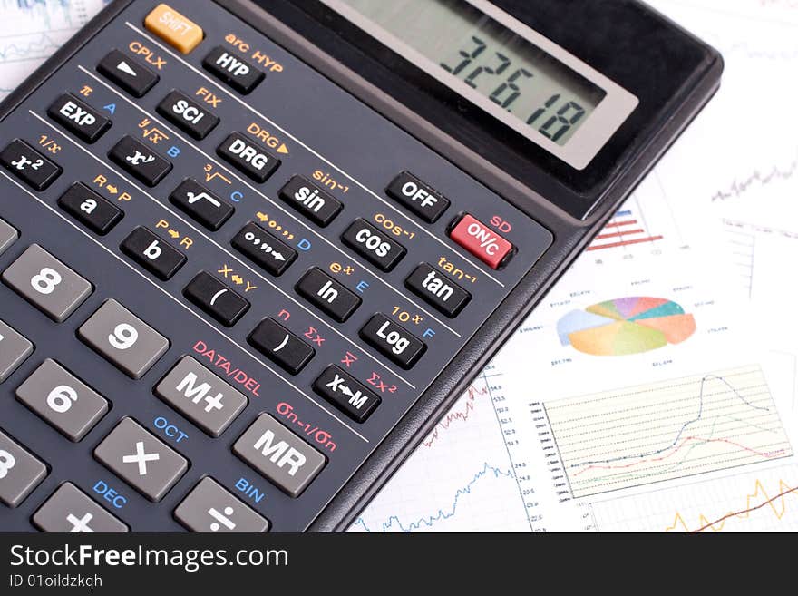 Financial statement with calculator and pen. Financial statement with calculator and pen