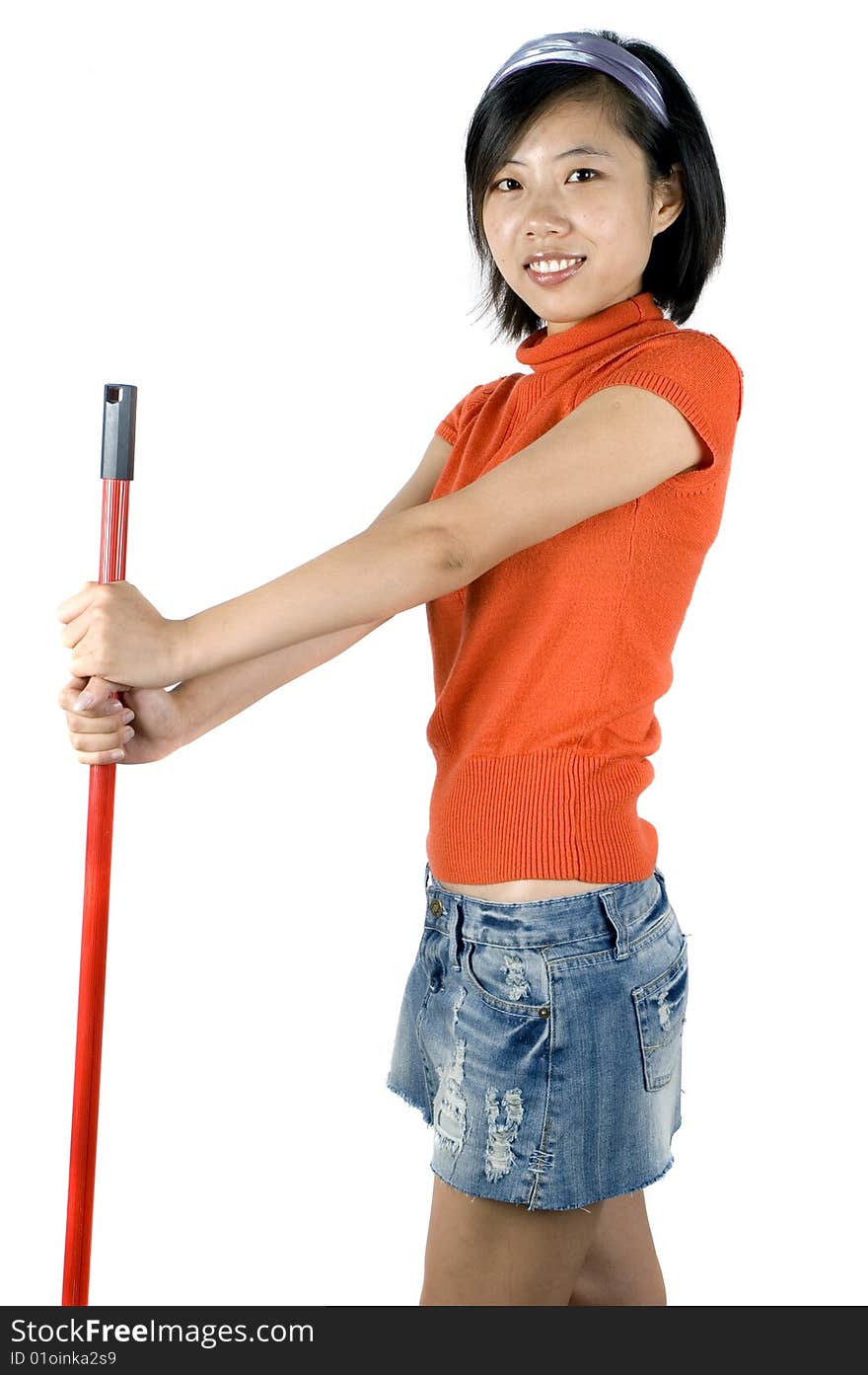 Happy, young Asian girl holding mop and cleaning house. Young housewife busy with her task. Happy, young Asian girl holding mop and cleaning house. Young housewife busy with her task.