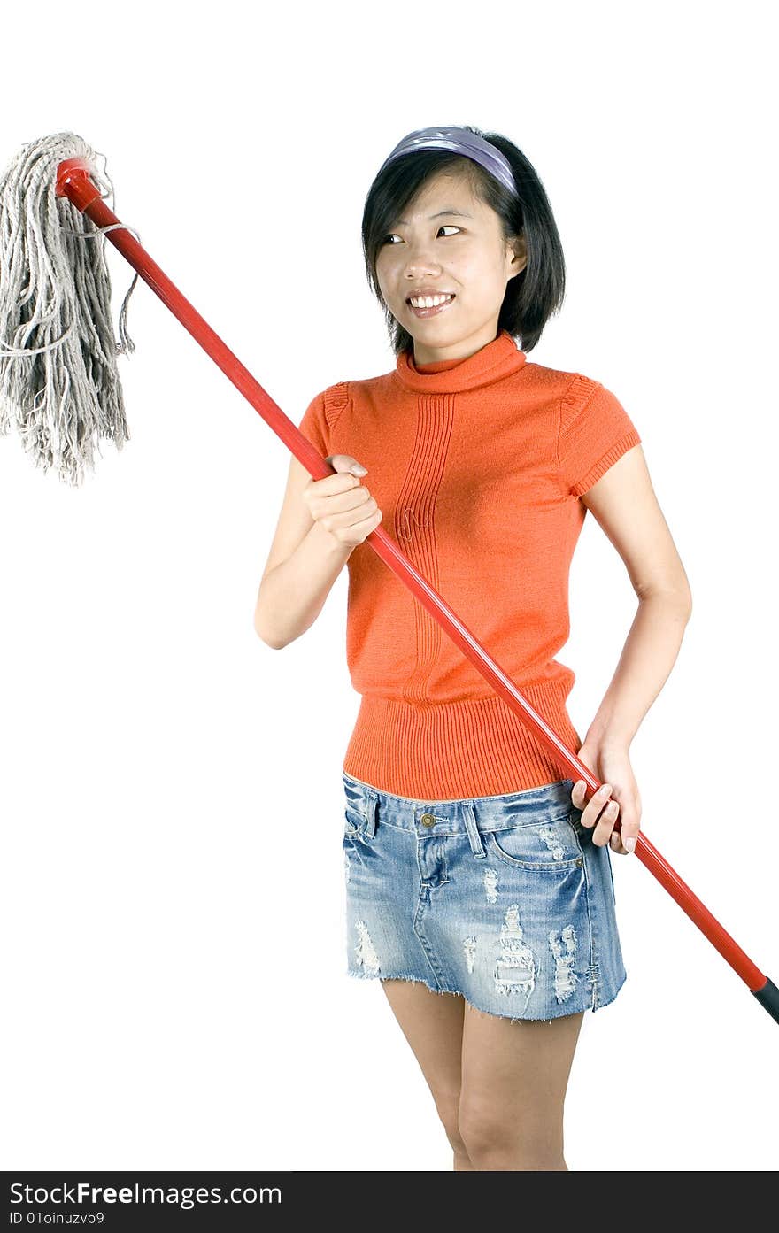 Happy, young Asian girl holding mop and cleaning house. Young housewife busy with her task. Happy, young Asian girl holding mop and cleaning house. Young housewife busy with her task.