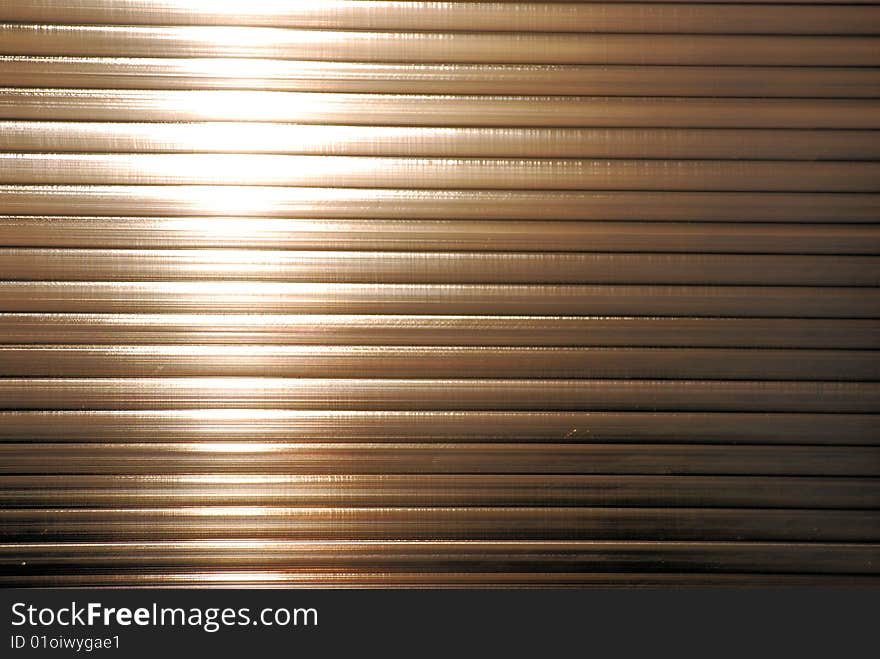 Illuminated steel shutters shot horizontally. Illuminated steel shutters shot horizontally.