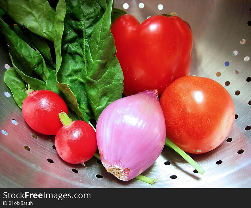 Vegetables fresh from the market washed and drained in a colander. Vegetables fresh from the market washed and drained in a colander.