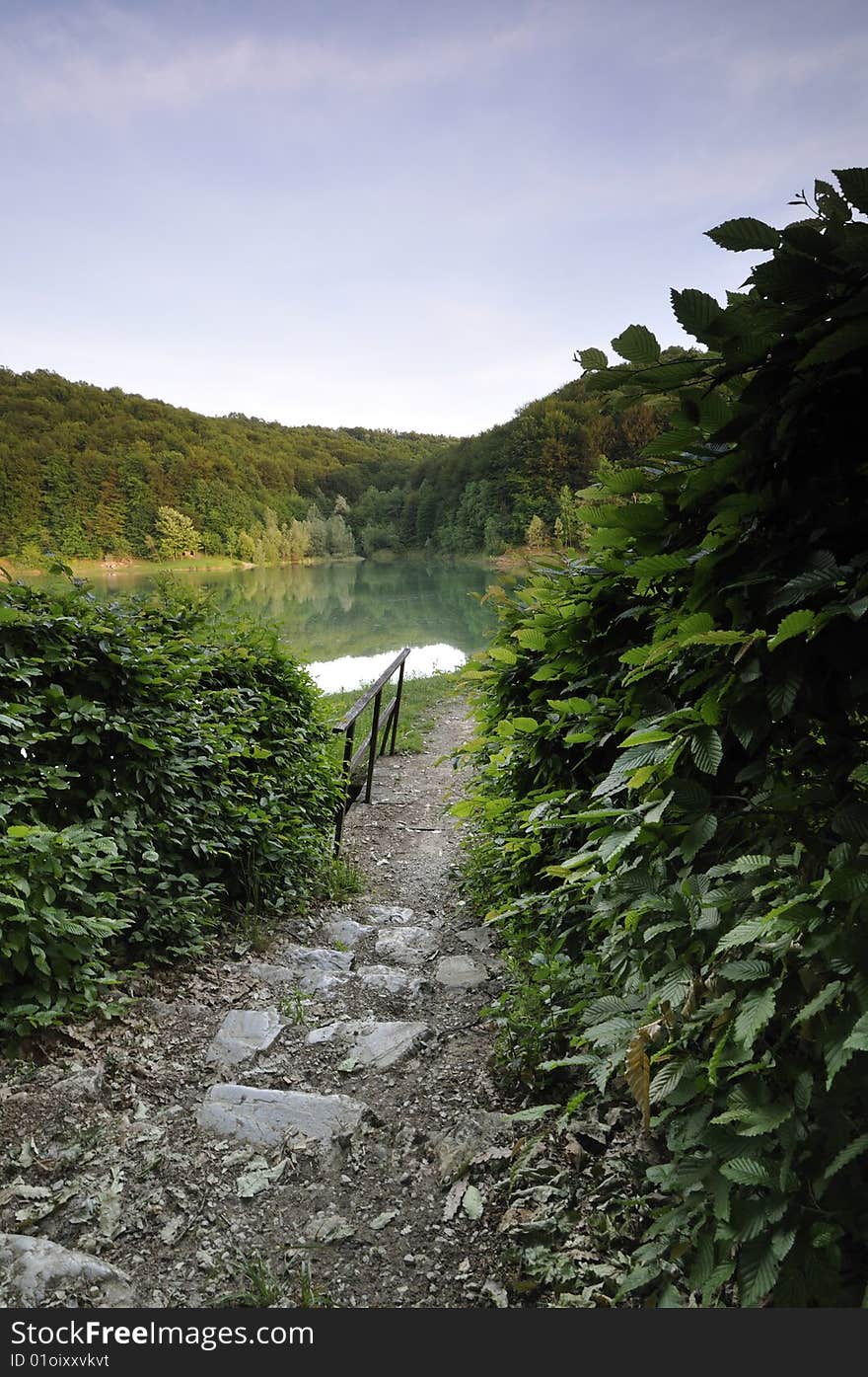 Entrance that leads to the walking path around the lake. Entrance that leads to the walking path around the lake