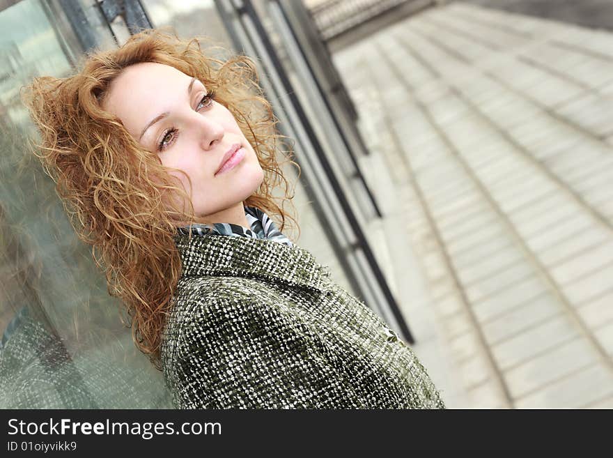 Beautiful woman standing against wall