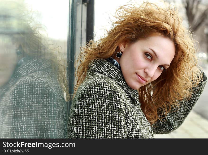 Beautiful woman standing against wall