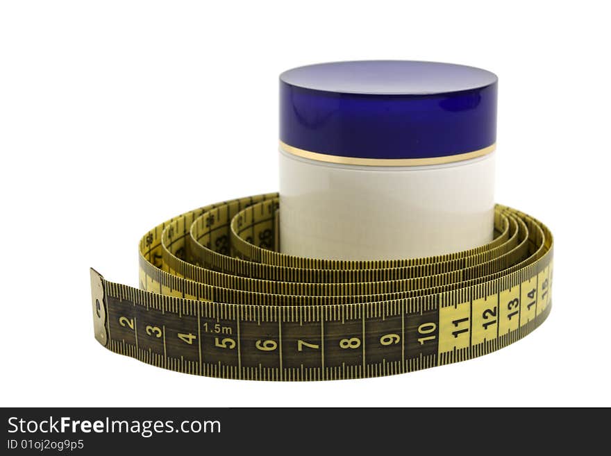 Container with cosmetic cream and measuring tape isolated on the white background. Container with cosmetic cream and measuring tape isolated on the white background