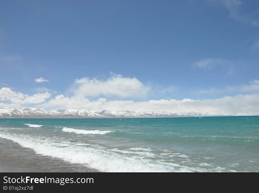 the blue Nam lake and sky sonw mountain in tibet