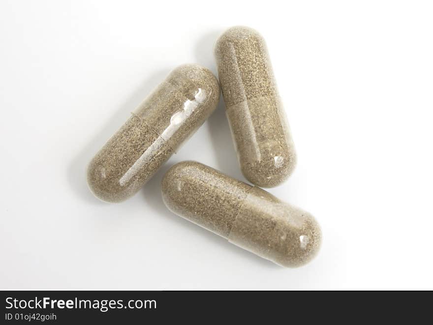 Gray pills on  white background