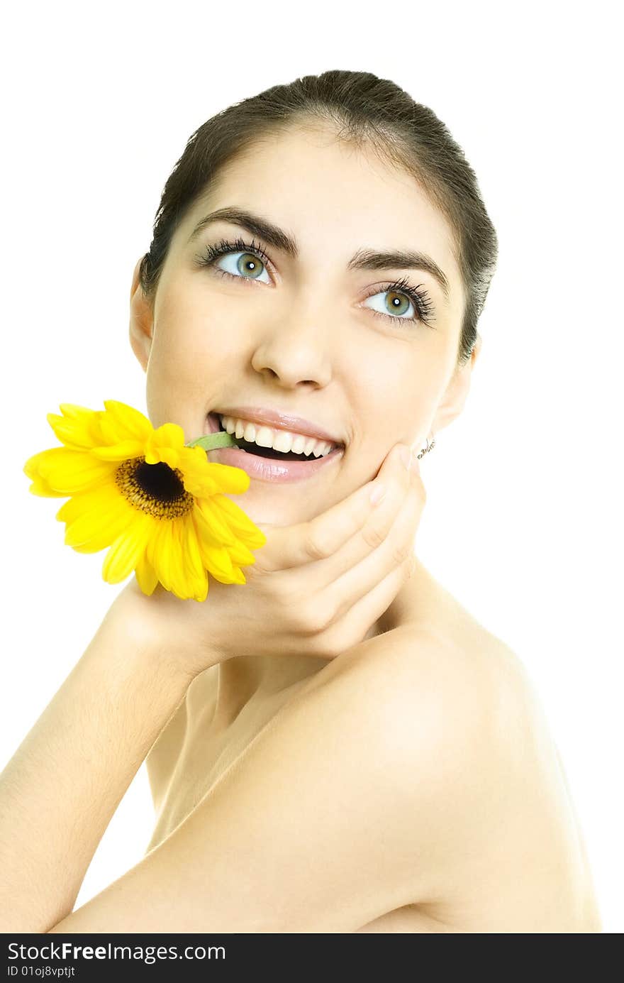 Pretty young dreamy woman with a yellow flower in her mouth. Pretty young dreamy woman with a yellow flower in her mouth