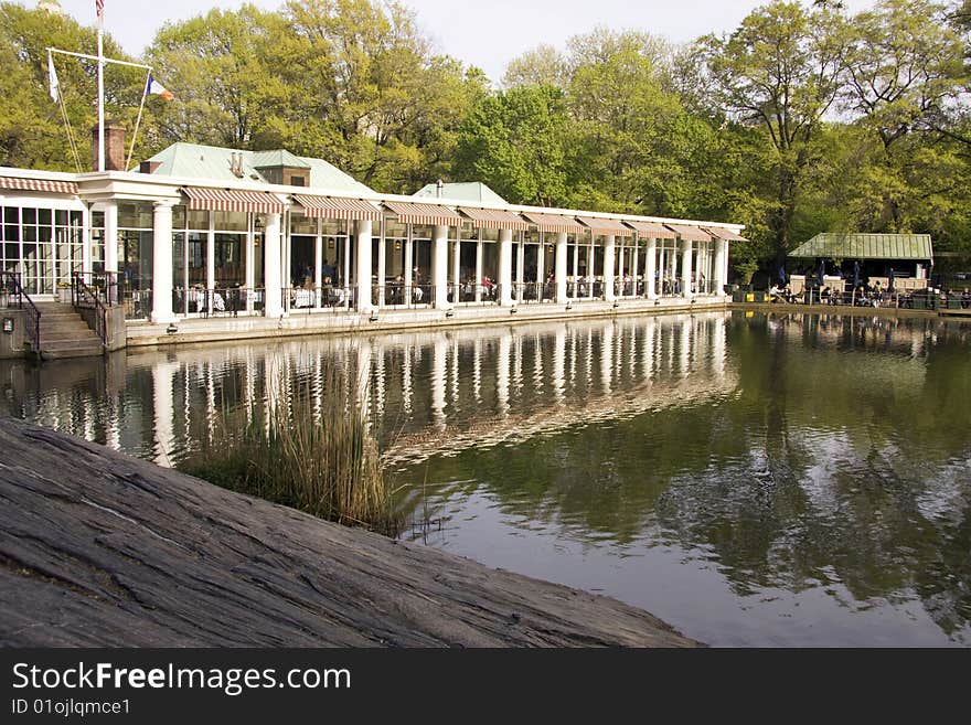 Building near a lake and a forest