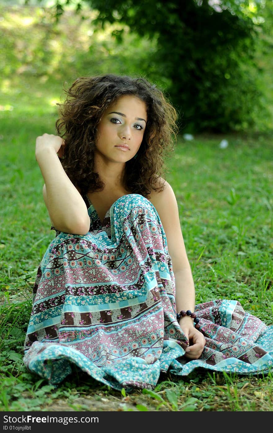 Smile teen standing on field in a park