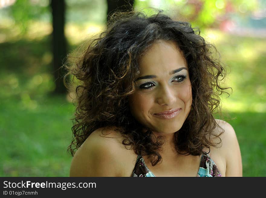 Smile teen standing on field in a park