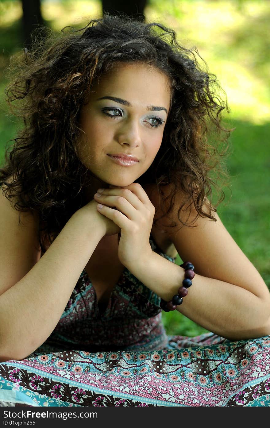 Smile teen standing on field in a park