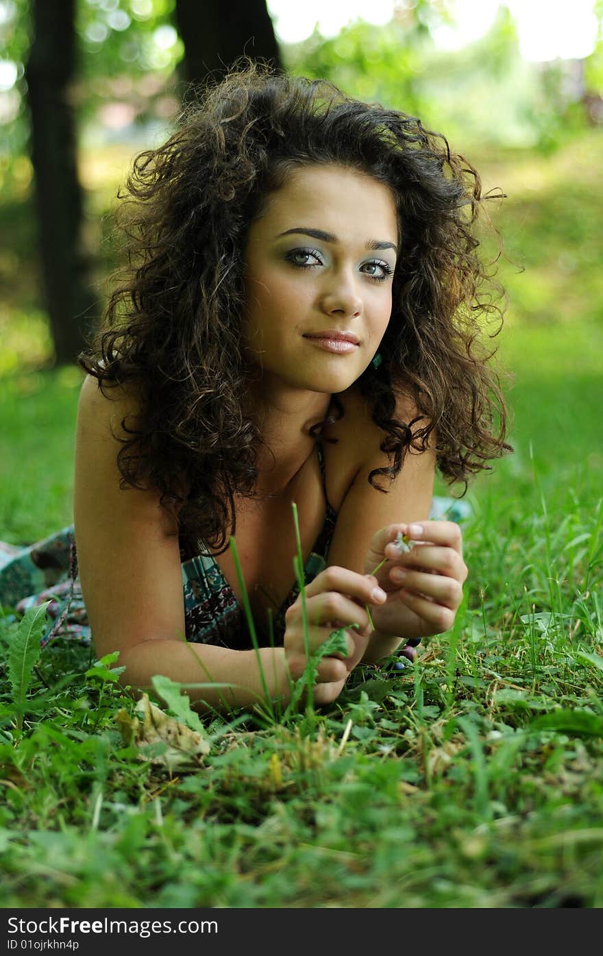 Smile teen standing on field in a park