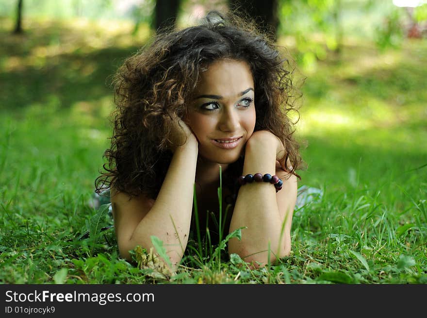 Smile teen standing on field in a park