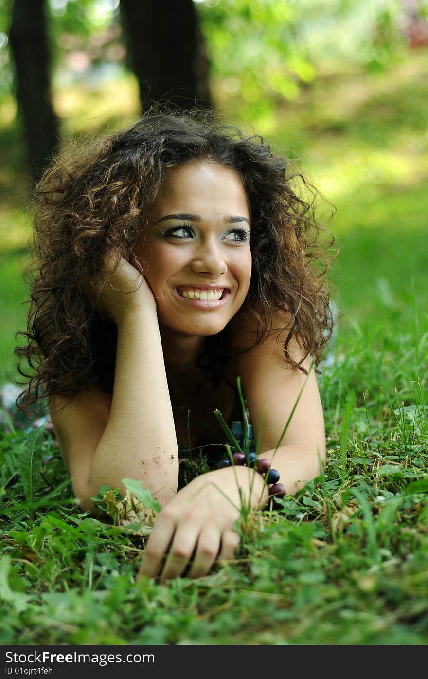 Smile teen standing on field in a park