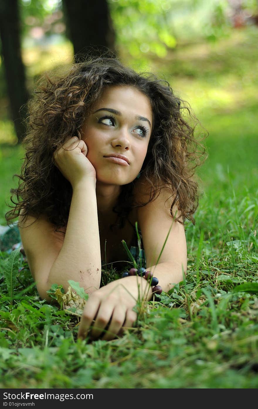 Smile teen standing on field in a park