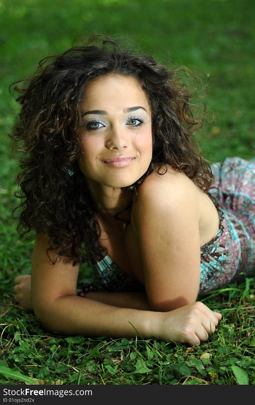 Smile teen standing on field in a park