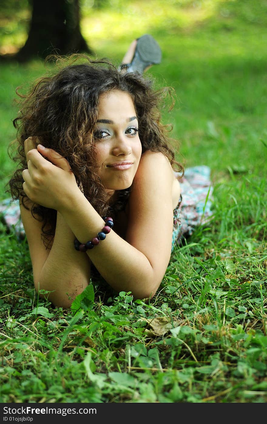 Smile teen standing on field in a park