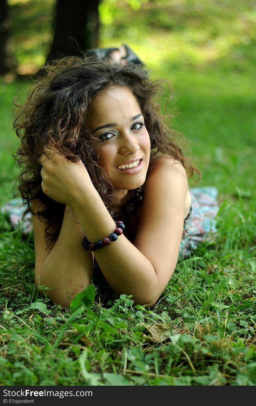 Smile teen standing on field in a park