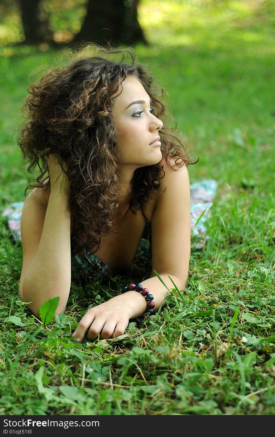 Smile teen standing on field in a park