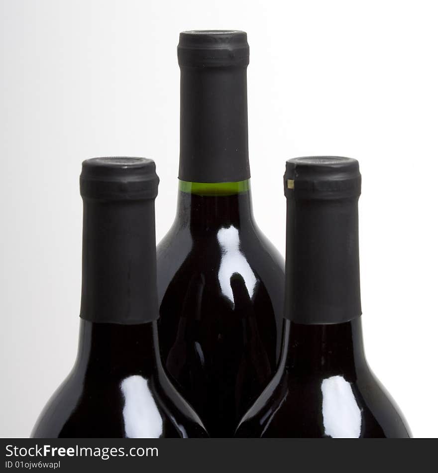 Three bottles of wine isolated on white