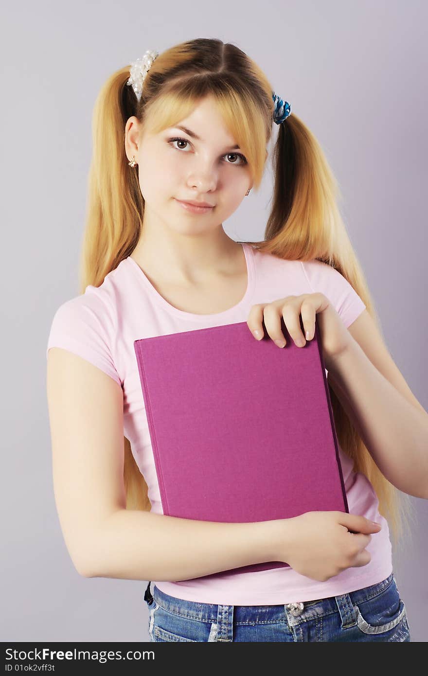 Portrait of a pretty student. Shot in a studio. Portrait of a pretty student. Shot in a studio.