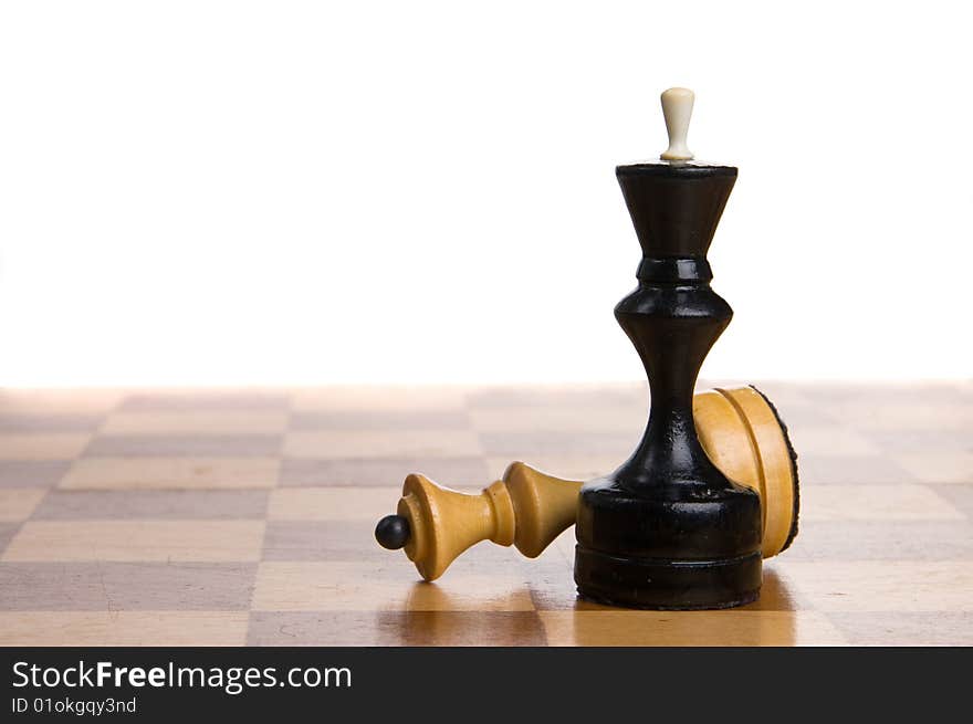 Two chessmen on a chessboard, white background