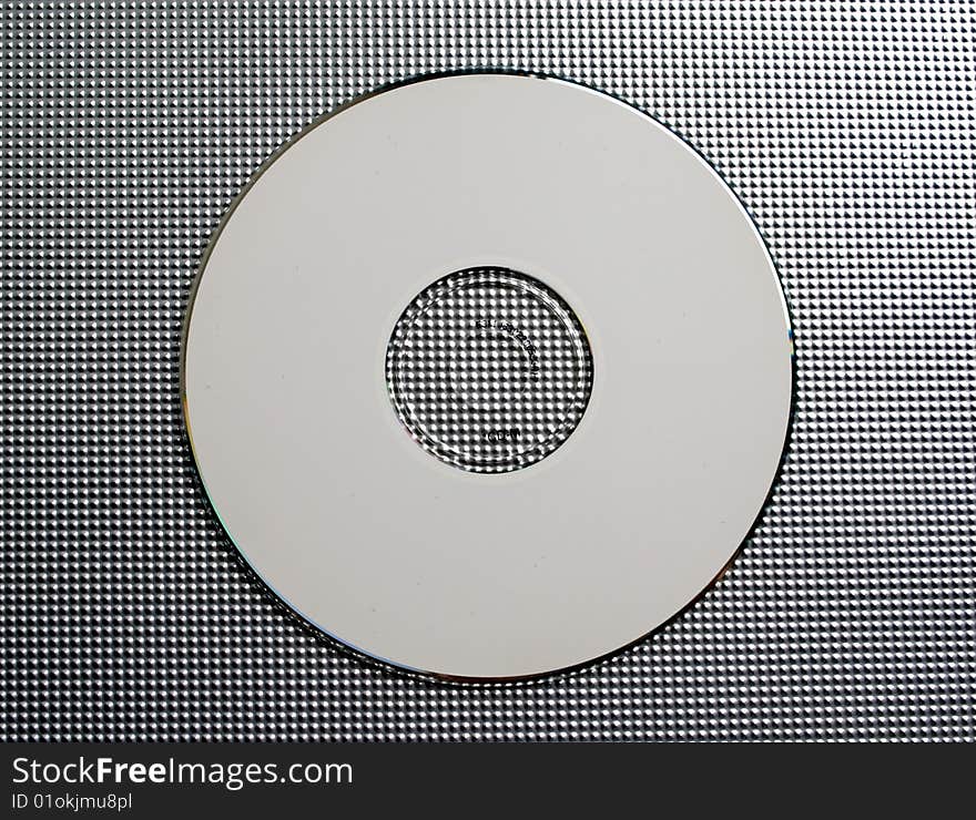 Musical disk on a grey background