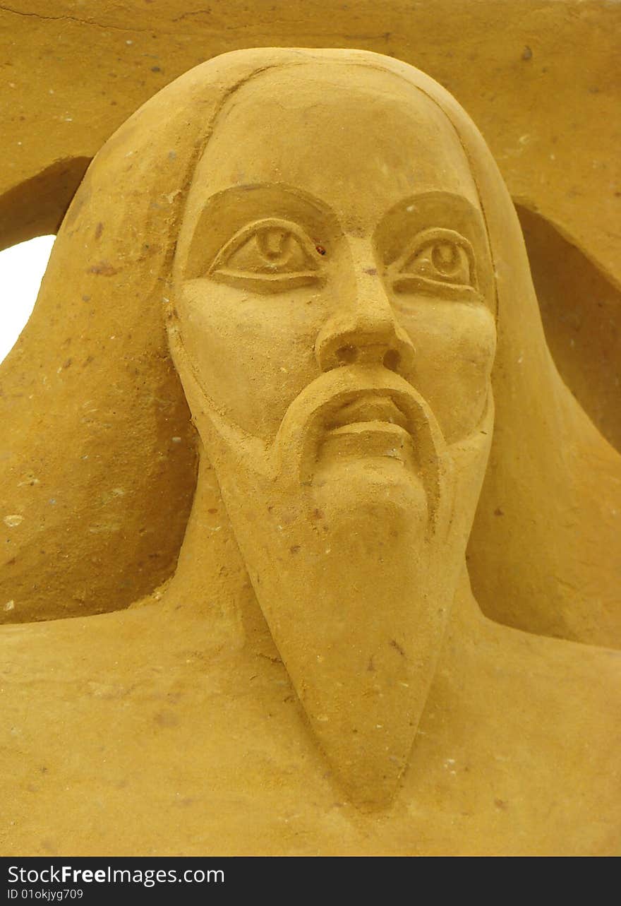 Figure of man from sand