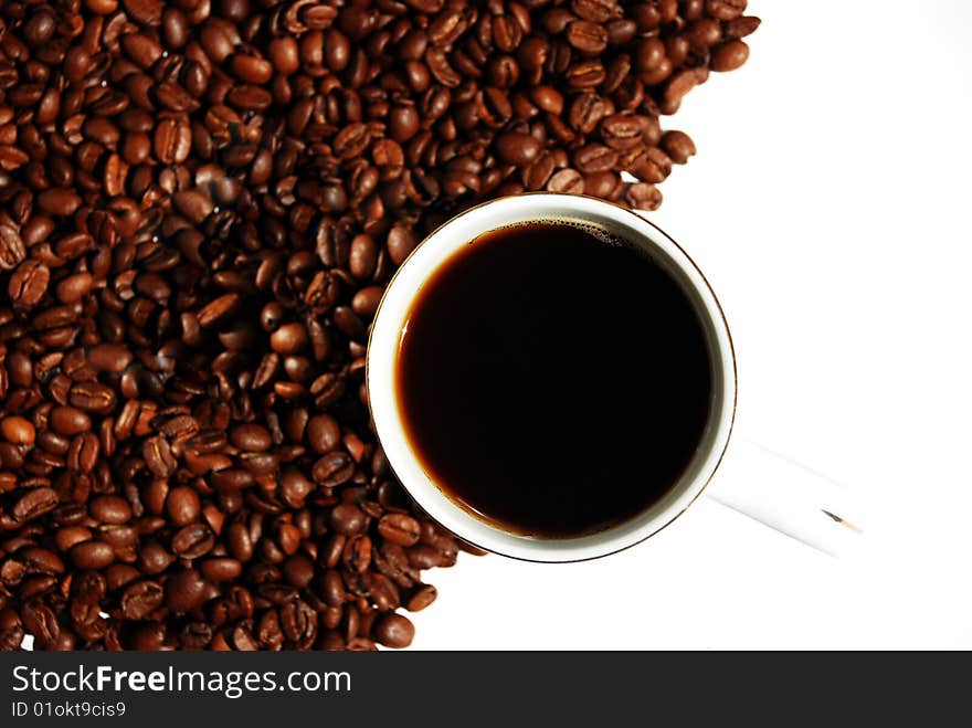 Coffee cup and grain on white background. Coffee cup and grain on white background