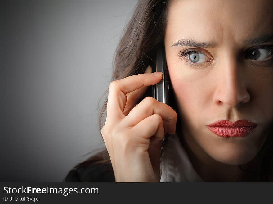 Closeup of businesswoman with mobile phone. Closeup of businesswoman with mobile phone