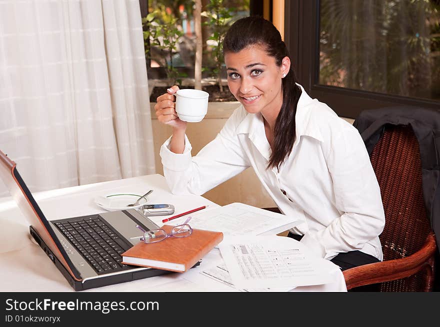 Young attractive businesswoman working in a restaurant