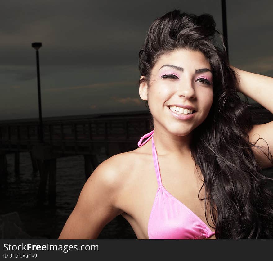 Woman in a bikini winking at the camera. Woman in a bikini winking at the camera