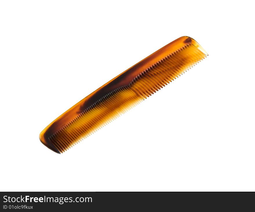 Plastic tortoise shell type hair comb isolated on white