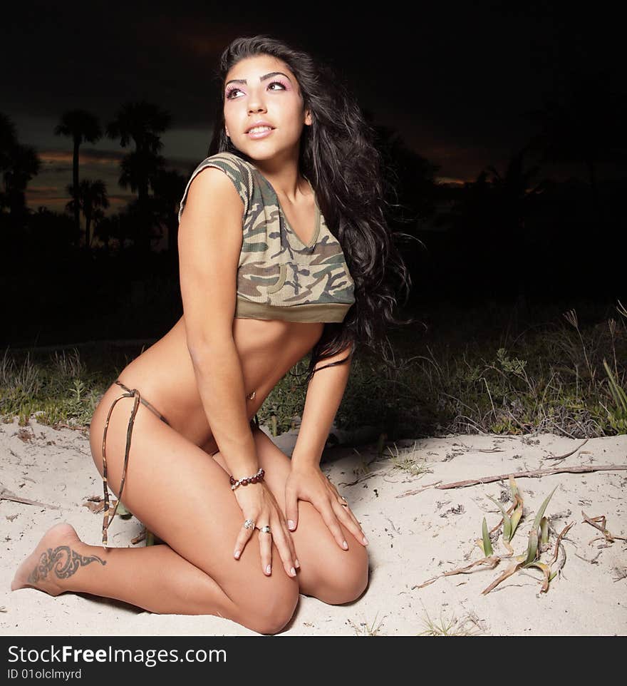 Young woman posing in the dunes at night. Young woman posing in the dunes at night