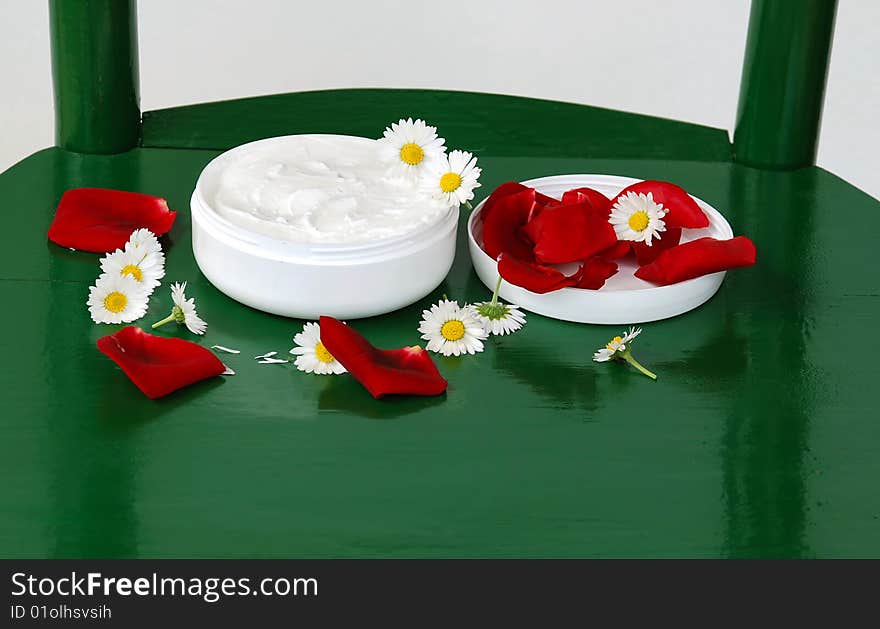 White cream round box with flower plant details. White cream round box with flower plant details