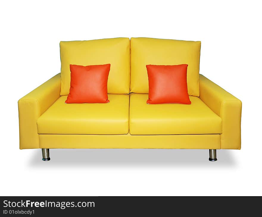 A clean and tidy yellow sofa and two pillows on it. A clean and tidy yellow sofa and two pillows on it.