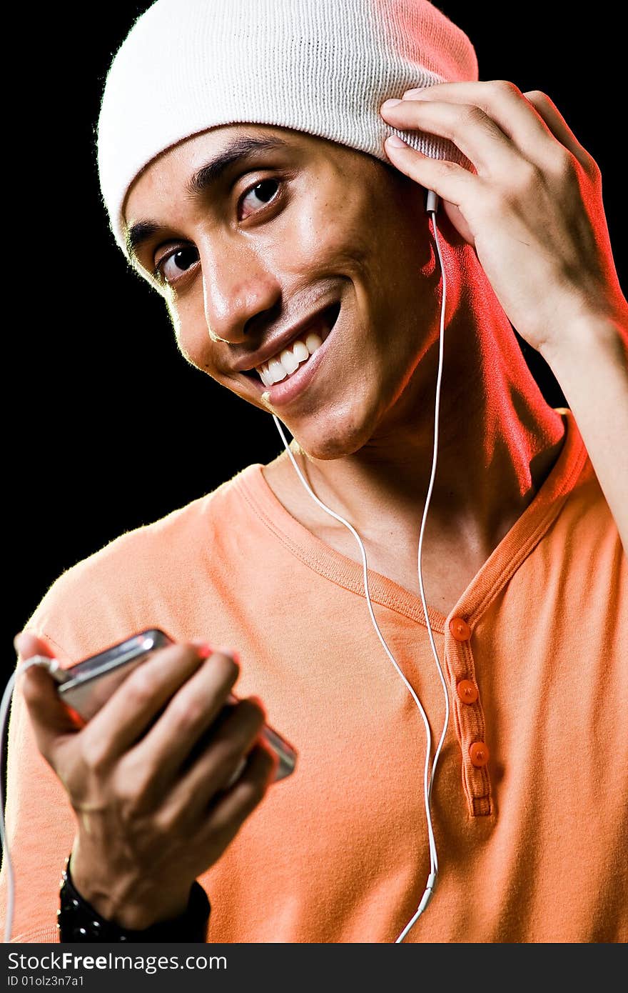 A handsome asian male listening to music