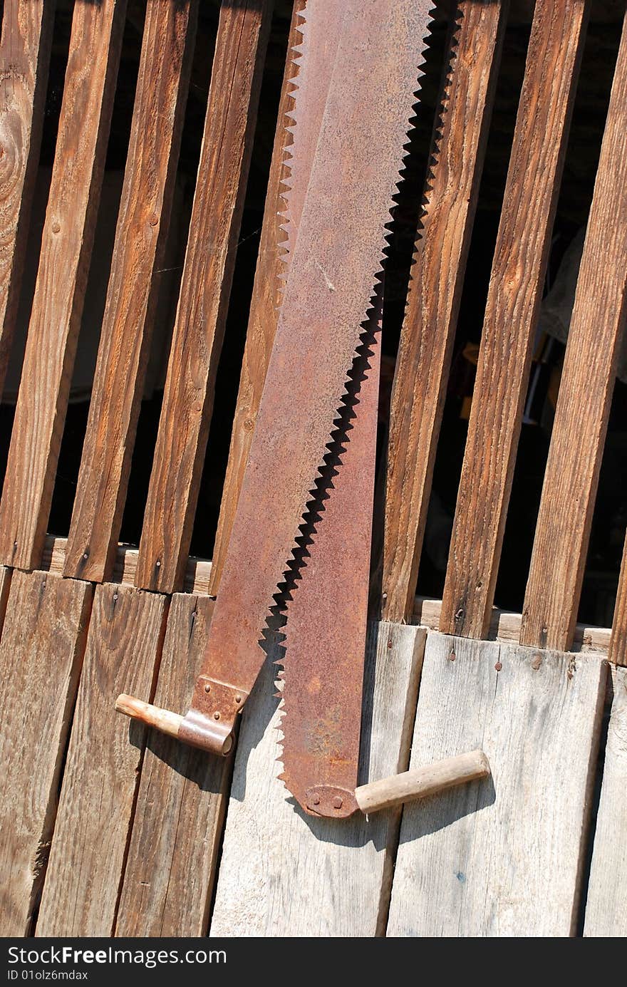 Two old bow saws hanging in a carpentry