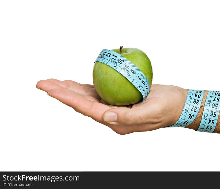 Close up of hand with apple and measuring tape