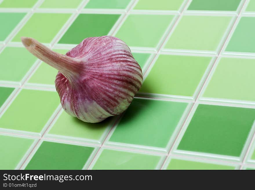 Head of the garlic for green ceramic tiled bar