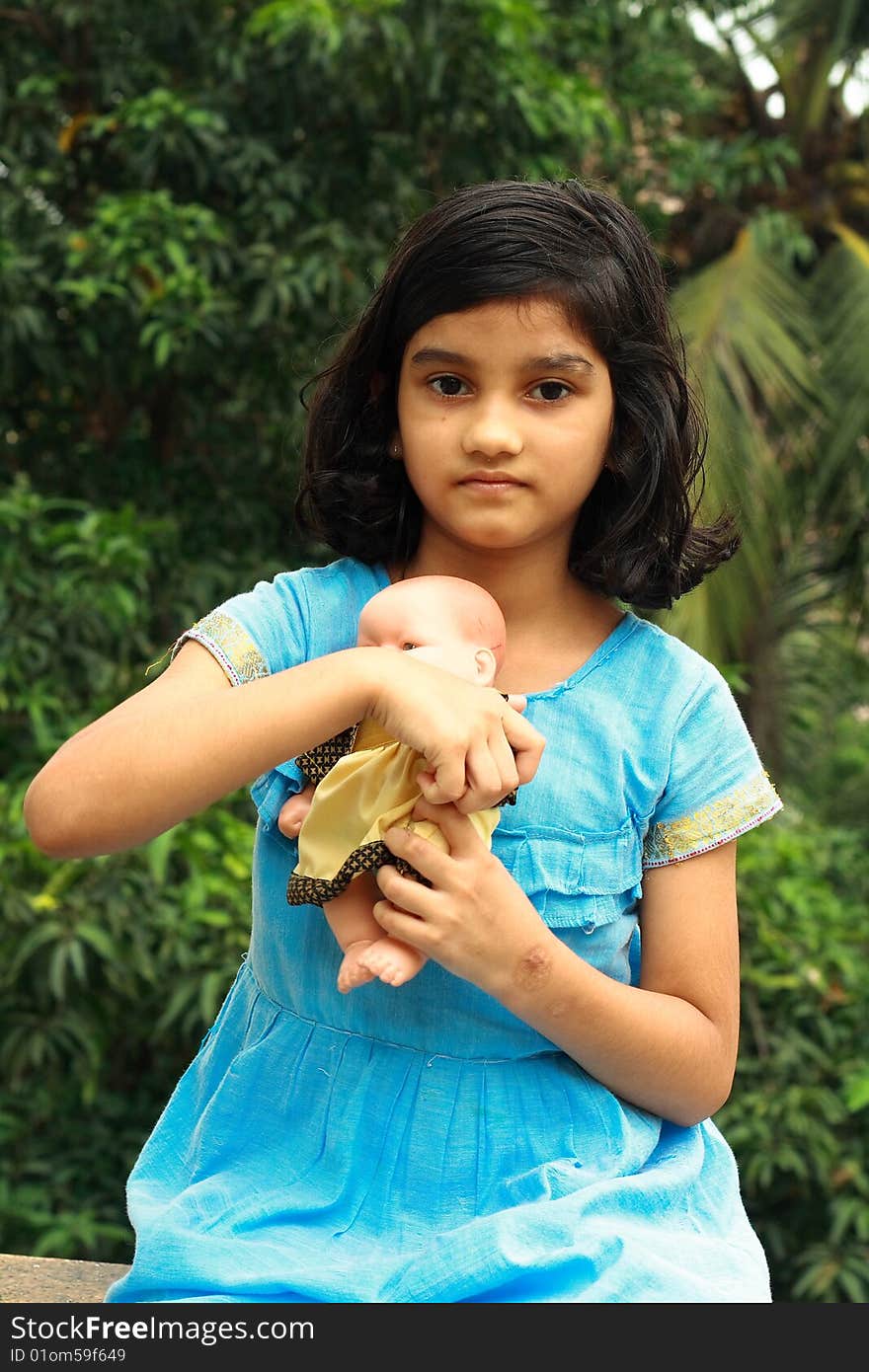 Girl with her doll