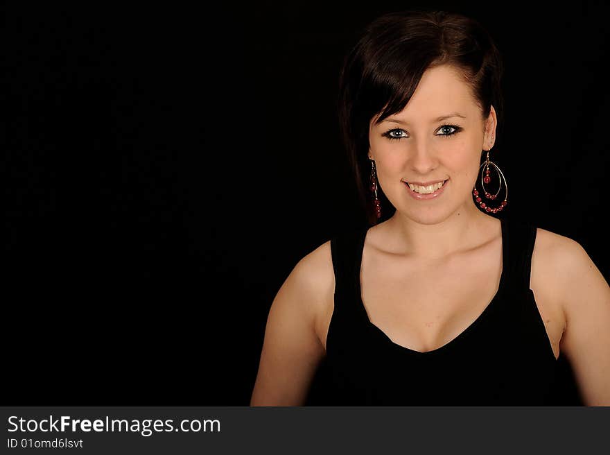 Pretty teenage woman on black background. Pretty teenage woman on black background