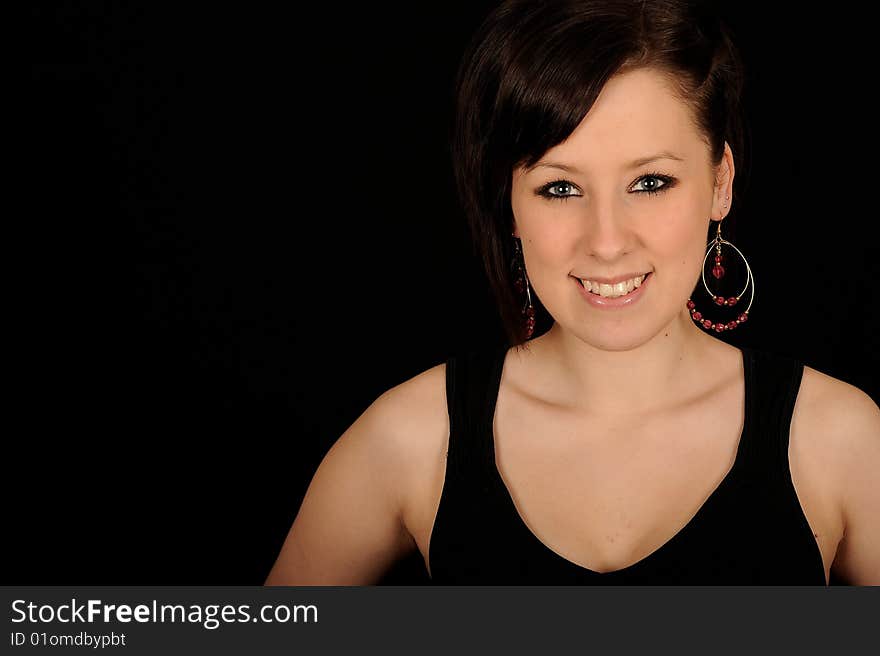 Pretty teenage woman on black background. Pretty teenage woman on black background