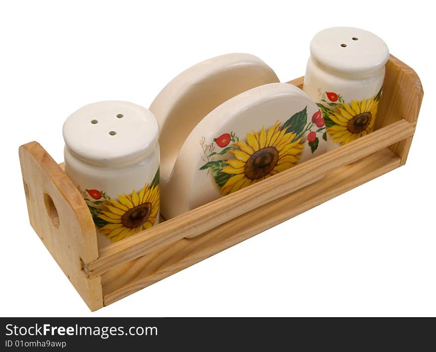 Handmade salt shaker, pepper shaker and napkin holder on white background