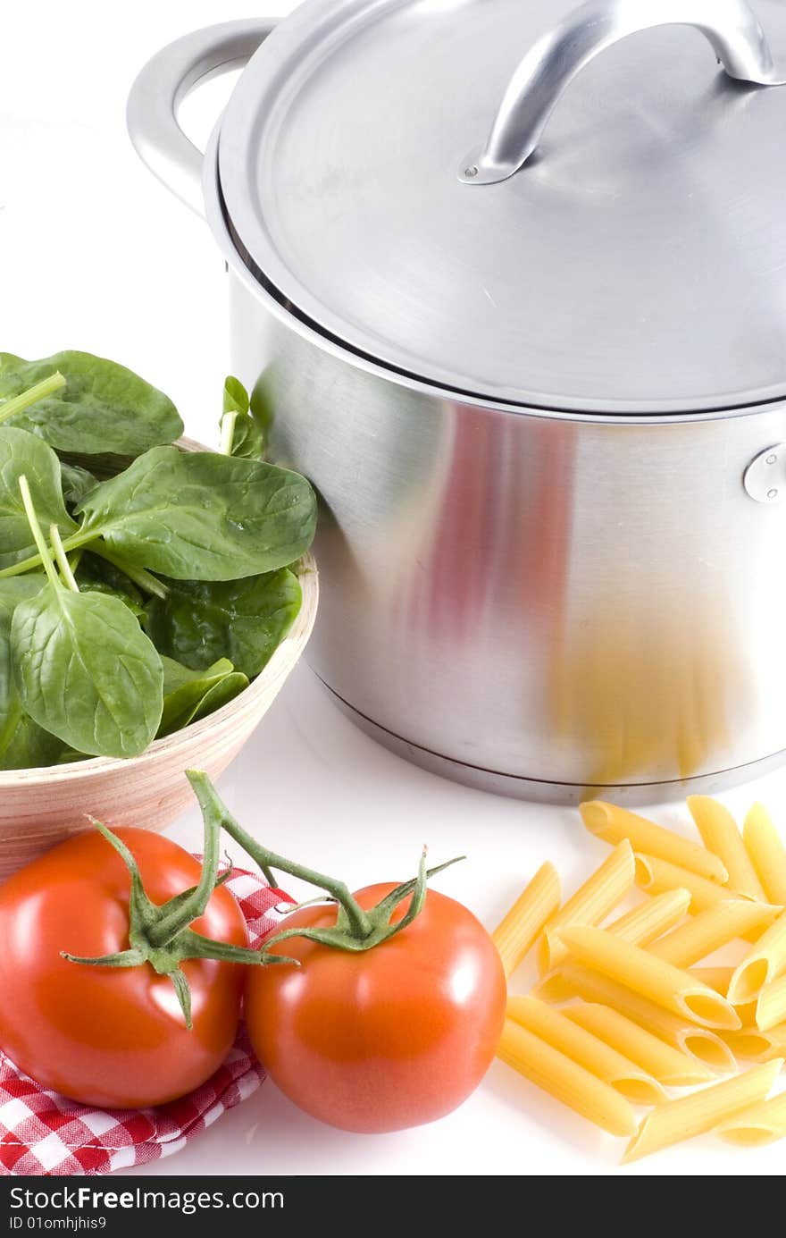 A pan and some ingredients on a white background. A pan and some ingredients on a white background.