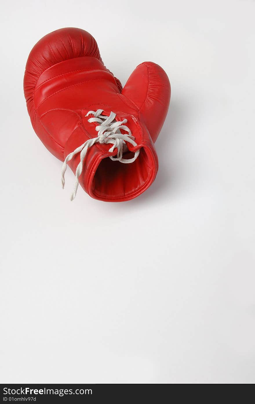 Red boxing glove with white lacing